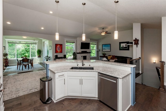 9180 Geanna Ct, West Des Moines, IA 50266 - kitchen featuring stainless steel dishwasher, open floor plan, dark wood finished floors, a center island with sink, and white cabinetry