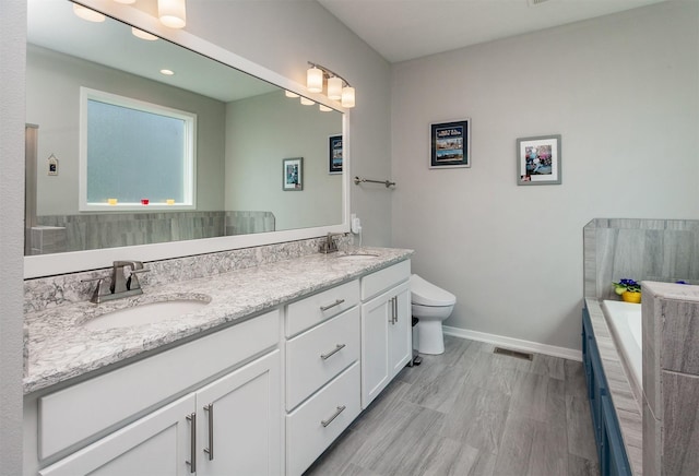 9180 Geanna Ct, West Des Moines, IA 50266 - bathroom with double vanity and a bath
