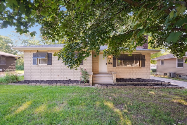 2515 Glenbrook Dr, Des Moines, IA 50316 - view of front of property with brick siding, a front lawn, and a chimney
