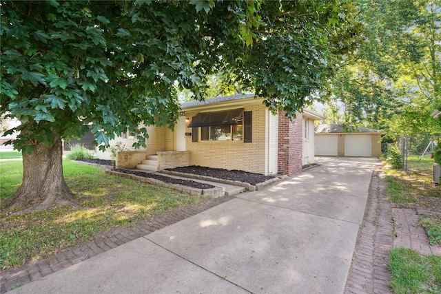 2515 Glenbrook Dr, Des Moines, IA 50316 - view of front of property featuring brick siding, a detached garage, and an outdoor structure