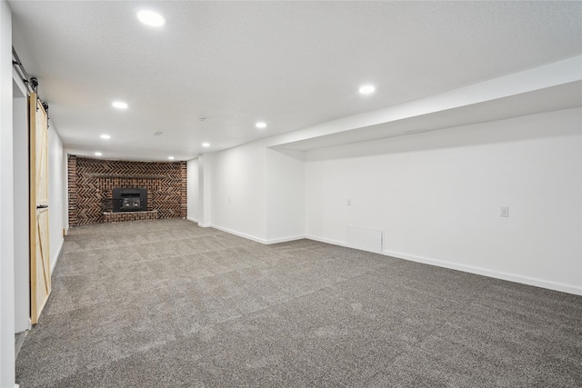 2515 Glenbrook Dr, Des Moines, IA 50316 - unfurnished living room with recessed lighting, carpet floors, and a barn door