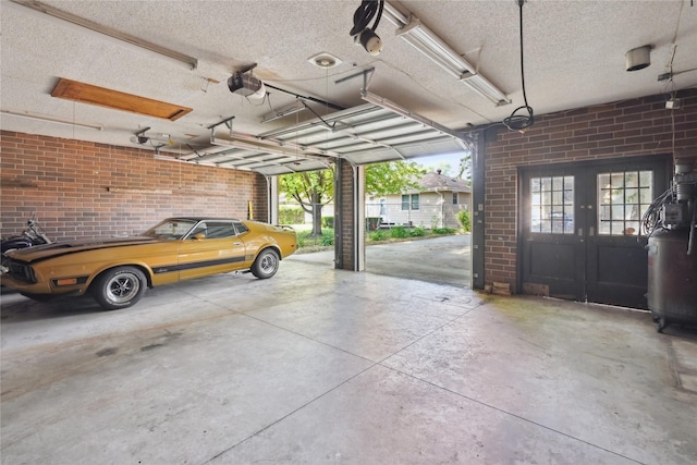 2515 Glenbrook Dr, Des Moines, IA 50316 - garage featuring french doors and a garage door opener