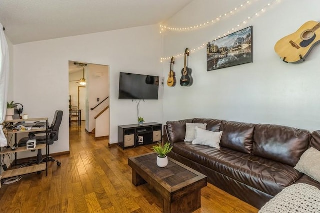 926 Casady Dr, Norwalk, IA 50211 - living room with lofted ceiling, hardwood / wood-style flooring, stairway, and a ceiling fan