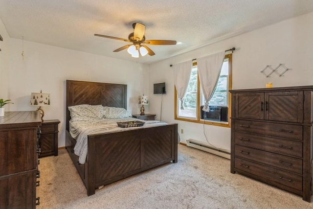 926 Casady Dr, Norwalk, IA 50211 - bedroom featuring a baseboard radiator, light carpet, a ceiling fan, and a textured ceiling