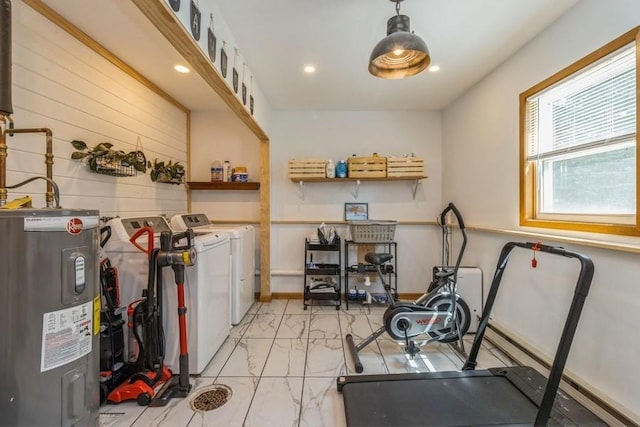 926 Casady Dr, Norwalk, IA 50211 - workout area with electric water heater, washing machine and dryer, light marble finish flooring, and recessed lighting
