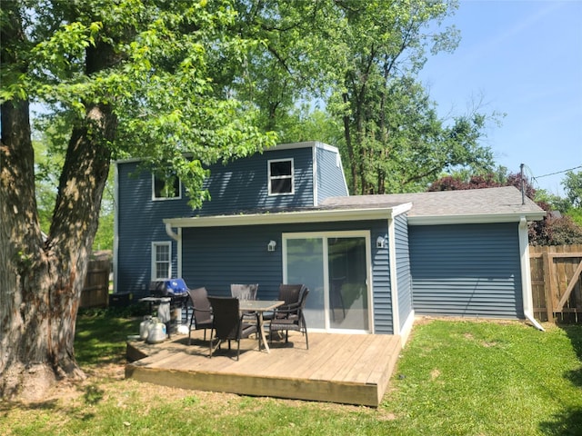 707 E 27th St S, Newton, IA 50208 - rear view of property with a deck, a shingled roof, and outdoor dining area