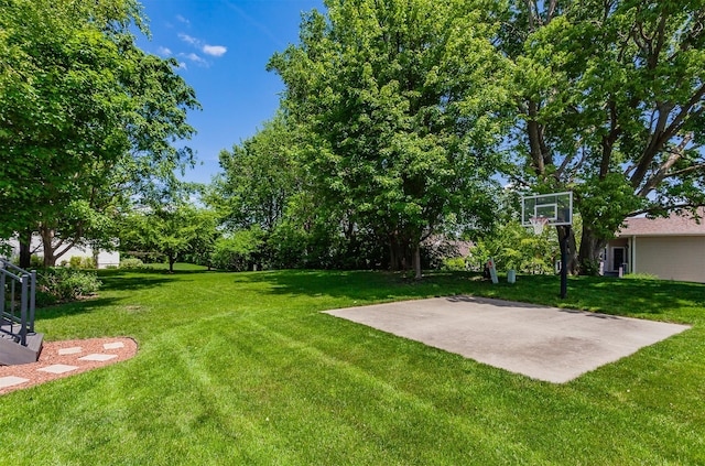 6511 NW 93rd St, Johnston, IA 50131 - view of grassy yard with basketball hoop