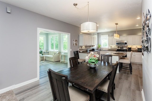 6511 NW 93rd St, Johnston, IA 50131 - dining area with plenty of natural light, light wood-type flooring, and recessed lighting