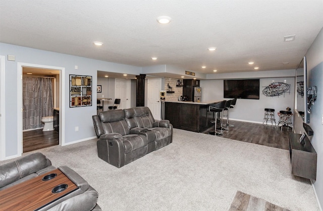 6511 NW 93rd St, Johnston, IA 50131 - living room featuring a dry bar, recessed lighting, and dark carpet