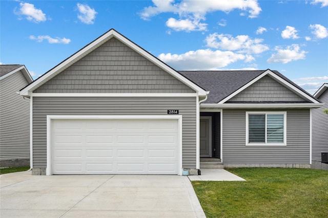 2814 Long Ave, Van Meter, IA 50261 - view of front of property featuring concrete driveway, a front lawn, an attached garage, and roof with shingles