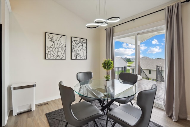 2814 Long Ave, Van Meter, IA 50261 - dining room featuring light wood finished floors and a chandelier