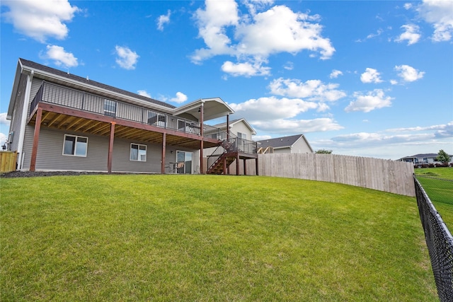 2814 Long Ave, Van Meter, IA 50261 - rear view of property featuring stairway, a fenced backyard, and a wooden deck