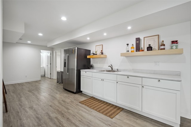 2814 Long Ave, Van Meter, IA 50261 - kitchen featuring stainless steel refrigerator with ice dispenser, open shelves, recessed lighting, white cabinetry, and light wood-type flooring