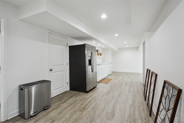 2814 Long Ave, Van Meter, IA 50261 - kitchen with stainless steel fridge, light wood-type flooring, white cabinetry, recessed lighting, and light countertops