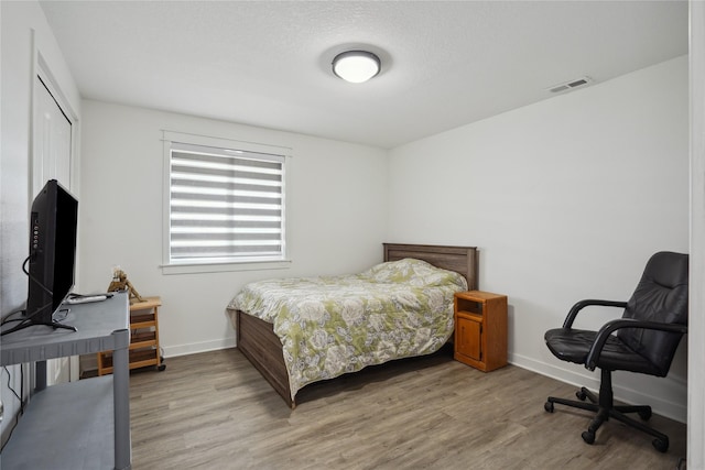 2814 Long Ave, Van Meter, IA 50261 - bedroom featuring wood finished floors and a closet