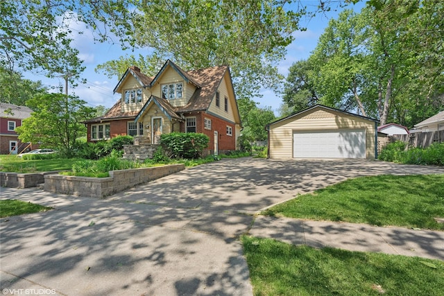 3320 SW 12th St, Des Moines, IA 50315 - view of front of property featuring a detached garage, an outdoor structure, a chimney, and brick siding