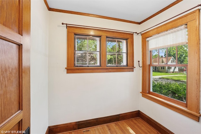 3320 SW 12th St, Des Moines, IA 50315 - spare room featuring wood finished floors and crown molding