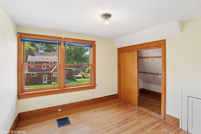 3320 SW 12th St, Des Moines, IA 50315 - unfurnished bedroom featuring light wood finished floors and a closet