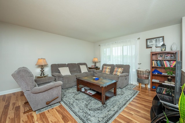 4012 79th St, Urbandale, IA 50322 - living area with light wood-type flooring and baseboards