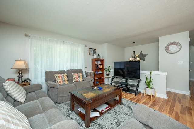 4012 79th St, Urbandale, IA 50322 - living area featuring a chandelier and wood finished floors