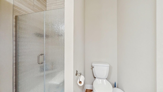 469 SE Hollow Ct, West Des Moines, IA 50265 - bathroom featuring toilet and a shower stall