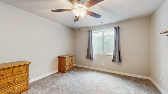 469 SE Hollow Ct, West Des Moines, IA 50265 - unfurnished bedroom featuring light colored carpet, ceiling fan, and a textured ceiling