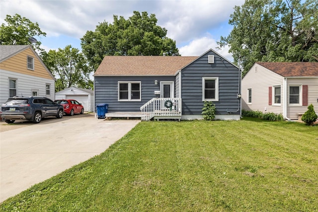 1428 E Tiffin Ave, Des Moines, IA 50316 - bungalow-style house featuring a front lawn, an outbuilding, and roof with shingles