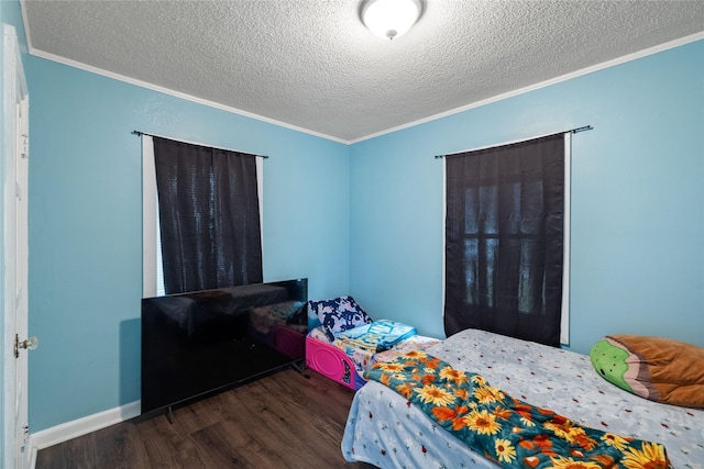 1428 E Tiffin Ave, Des Moines, IA 50316 - bedroom with ornamental molding, a textured ceiling, and wood finished floors