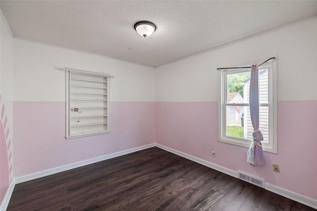 1428 E Tiffin Ave, Des Moines, IA 50316 - empty room featuring dark wood-style floors and a textured ceiling
