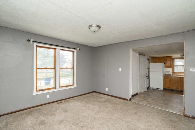 2420 Maple St, Des Moines, IA 50317 - unfurnished room with carpet and baseboards