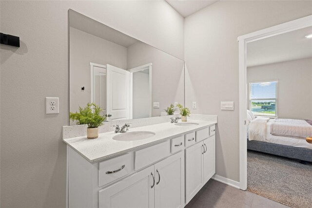 10525 Powell Ave, Johnston, IA 50131 - ensuite bathroom featuring double vanity and tile patterned floors
