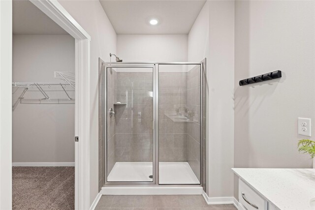 10525 Powell Ave, Johnston, IA 50131 - full bath featuring a stall shower, vanity, and a spacious closet