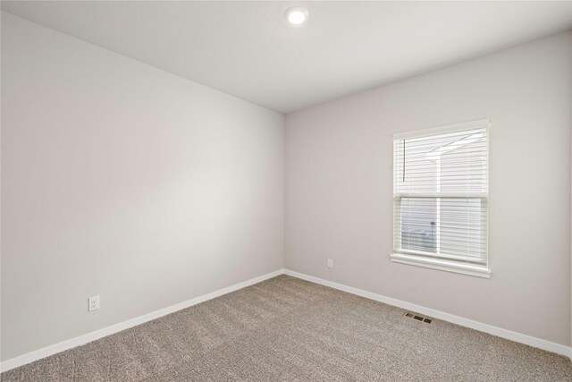 10525 Powell Ave, Johnston, IA 50131 - empty room with light carpet and recessed lighting