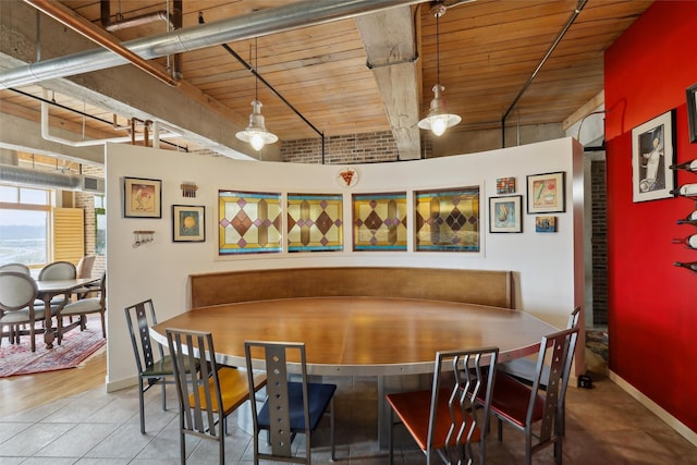 100 Market St Unit 409, Des Moines, IA 50309 - dining space featuring a wooden ceiling with exposed beams and tile patterned flooring