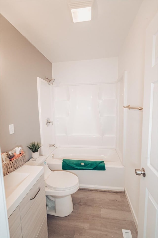 3405 30th St, Des Moines, IA 50310 - full bathroom with wood finished floors, vanity, and tub / shower combination