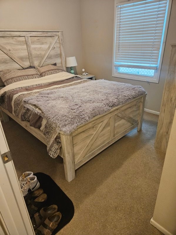 113 E 36th St, Des Moines, IA 50317 - bedroom with carpet flooring and baseboards