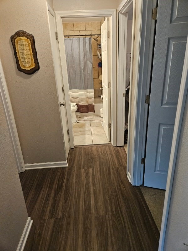 113 E 36th St, Des Moines, IA 50317 - hallway with wood finished floors and baseboards