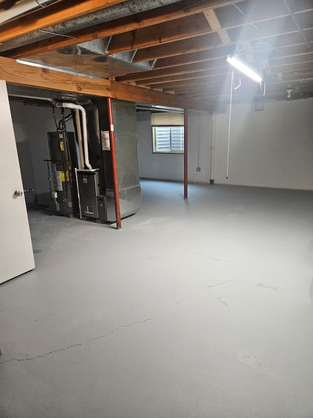 113 E 36th St, Des Moines, IA 50317 - below grade area featuring gas water heater and heating unit
