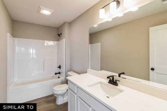 6502 NE Kendall Ave, Pleasant Hill, IA 50327 - bathroom featuring vanity, wood finished floors, and  shower combination