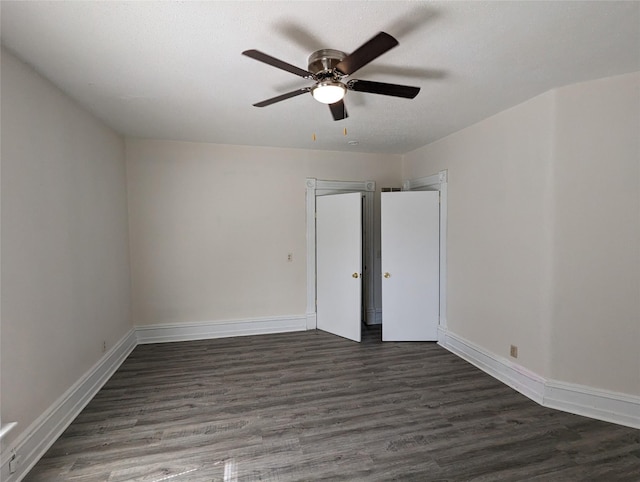1418 E 9th St, Des Moines, IA 50316 - empty room featuring ceiling fan and dark wood-style flooring