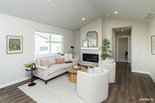 725 Linden St, Carlisle, IA 50047 - living area with dark wood-type flooring, lofted ceiling, recessed lighting, and a glass covered fireplace