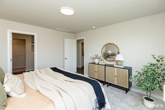 725 Linden St, Carlisle, IA 50047 - carpeted bedroom with a spacious closet and a closet