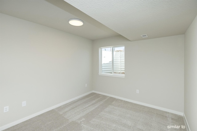 725 Linden St, Carlisle, IA 50047 - empty room with light colored carpet and a textured ceiling