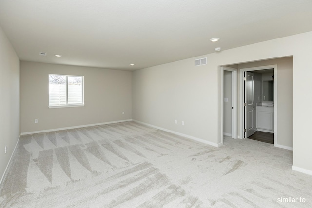 735 Linden St, Carlisle, IA 50047 - empty room featuring light carpet and recessed lighting