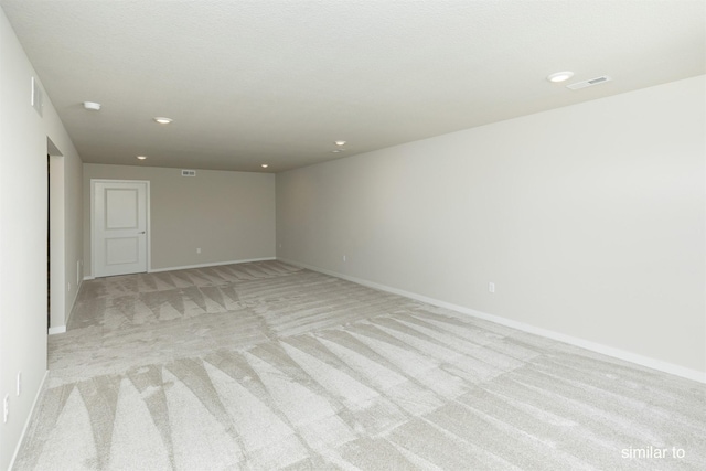 735 Linden St, Carlisle, IA 50047 - spare room featuring light colored carpet and recessed lighting