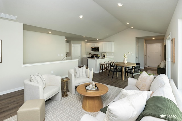 735 Linden St, Carlisle, IA 50047 - living room with wood finished floors, lofted ceiling, and recessed lighting