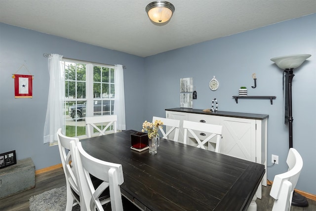1205 Lancaster Way, Indianola, IA 50125 - dining space with wood finished floors and a textured ceiling