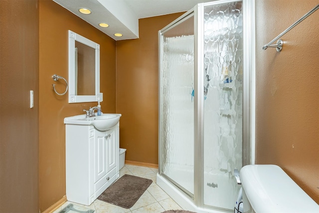 1205 Lancaster Way, Indianola, IA 50125 - full bath featuring vanity, a shower stall, and tile patterned flooring