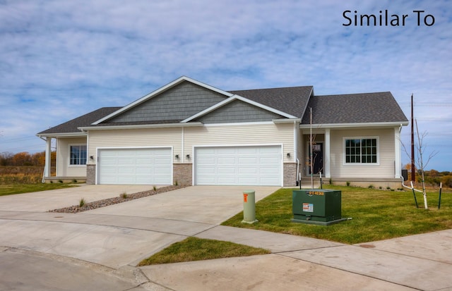 16732 Walnut Meadows Cir, Urbandale, IA 50323 - view of front of home featuring a front yard, concrete driveway, a garage, and a shingled roof