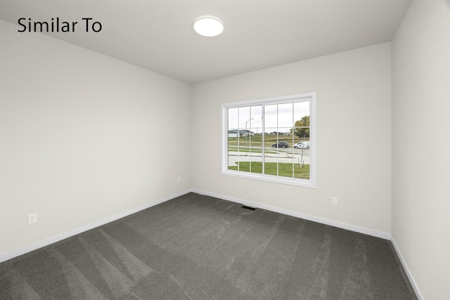 16732 Walnut Meadows Cir, Urbandale, IA 50323 - spare room featuring dark colored carpet